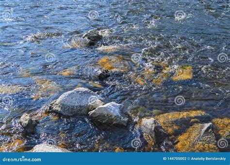 River flows washing stones, slow flow - sound effect