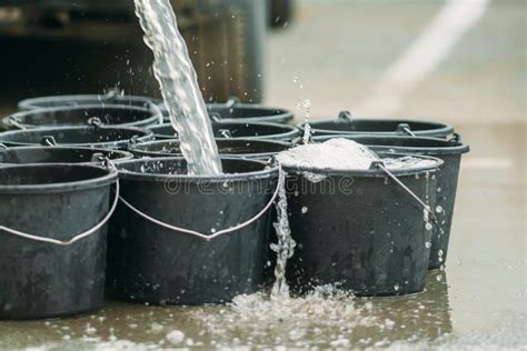 Bulk substance is poured into a plastic bucket - sound effect