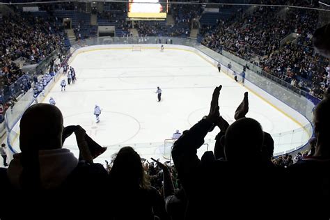 Crowd, inside the hockey arena: screams of children and teenagers - sound effect