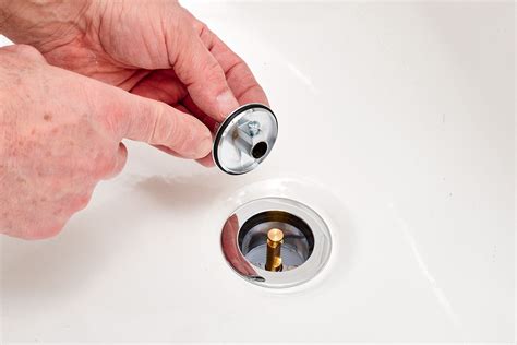 Water, removal of plug from a metal sink, stopper - sound effect