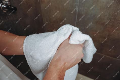 Sound of washing hands, then wiping them with a towel