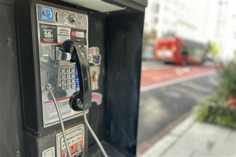 Sound of dialing a number in a payphone from 6 to 0, street phone