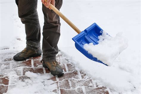 Sound of snow removal with a shovel, the creak of shoes in the snow