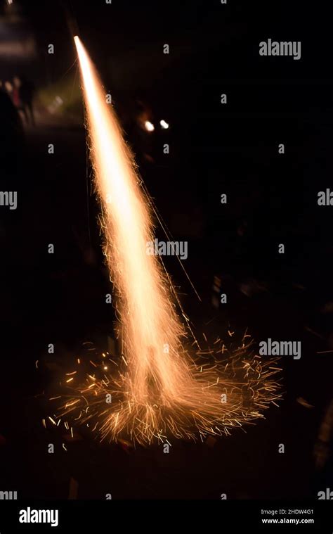 Fireworks with sparks and rockets: spectators in the background - sound effect