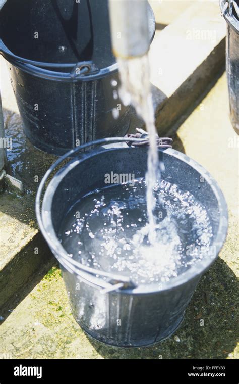 Rock salt is poured into a plastic bucket - sound effect