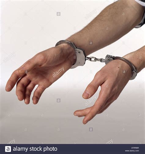Handcuffs on the wrists: latched and opened with a key - sound effect