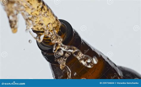 Uncorking a bottle of beer: pouring into a glass - sound effect