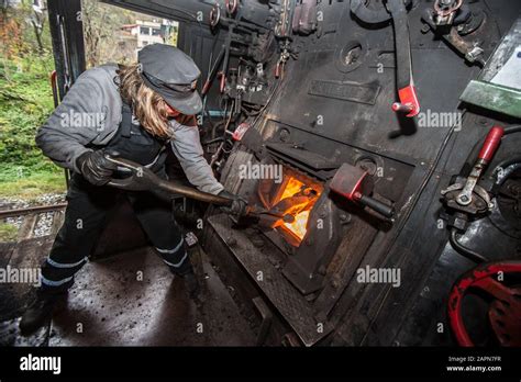 Steam locomotive, coal is thrown into the furnace with a shovel - sound effect