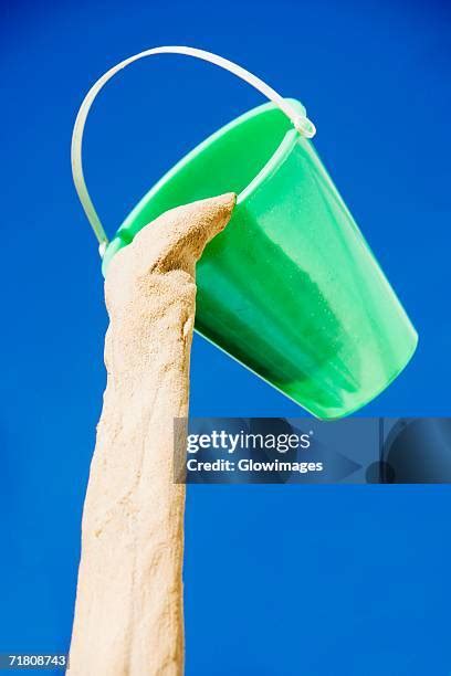 Sand is poured into a metal bucket - sound effect