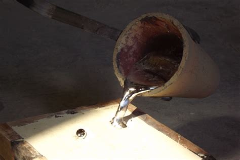 Sand is poured out of the bag into a metal container - sound effect