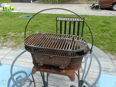 Antique cast iron stove, metal grill sound (grill)