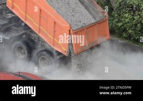 Dump truck unloads (pouring out) scrap metal - sound effect