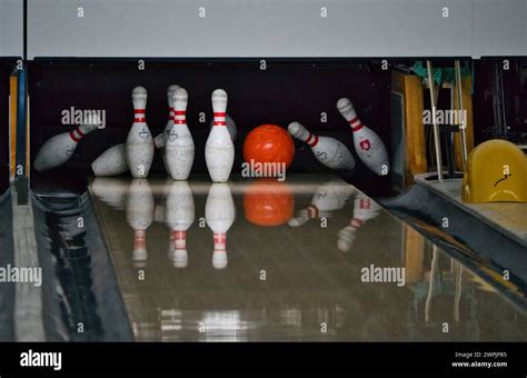 Knocking down pins in a bowling alley: in the background of a voice - sound effect