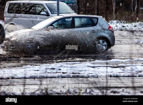 Car drives through snow puddle (fast) - sound effect