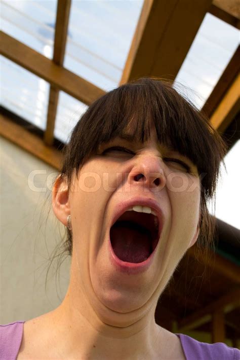 Sound of a female yawn, a woman yawns