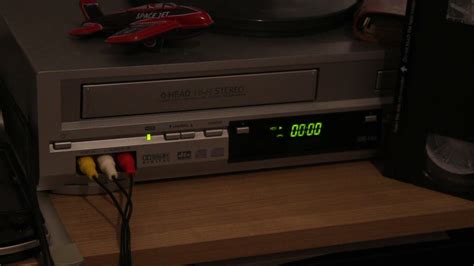 Inserting a video cassette into a vcr - sound effect