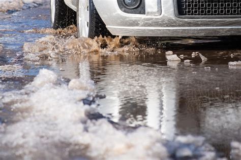 Car is moving through a puddle of ice - sound effect