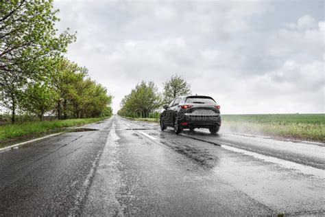 Wet suburban road, truck passing by - sound effect