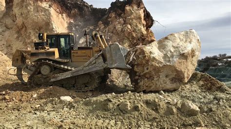 Bulldozer destroys a large stone wall - sound effect