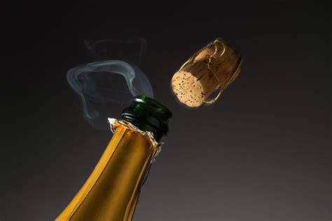 Cork pops out of a bottle of champagne - sound effect