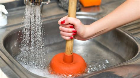 Plunger cleaning a clogged sink - sound effect