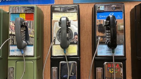 They throw a coin into the payphone, they call - sound effect